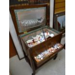 A vintage sewing box & contents including large quantity of old cotton reels Condition reports are