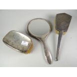 A matching silver backed brush & hand mirror together with another gentleman's machine turned silver