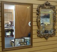 A modern wooden framed wall mirror & another fancy mirror Condition reports provided on request by