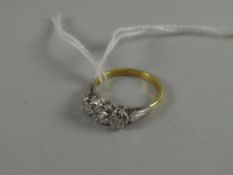 A three-stone diamond illusion setting ring set in 18ct white gold Condition reports provided on
