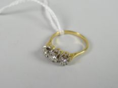 An 18ct yellow gold three-stone diamond ring Condition reports provided on request by email for this