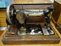 A vintage cased Singer sewing machine Condition reports provided on request by email for this