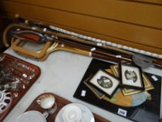 A parcel of walking sticks, a vintage tennis racket & sundry furnishing plaques Condition reports