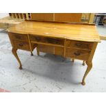 A vintage kneehole dressing table & a modern chest of drawers Condition reports provided on