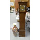 A vintage oak encased grandmother clock with brass dial & silver chapter ring together with a