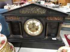An antique architectural slate mantel clock Condition reports provided on request by email for