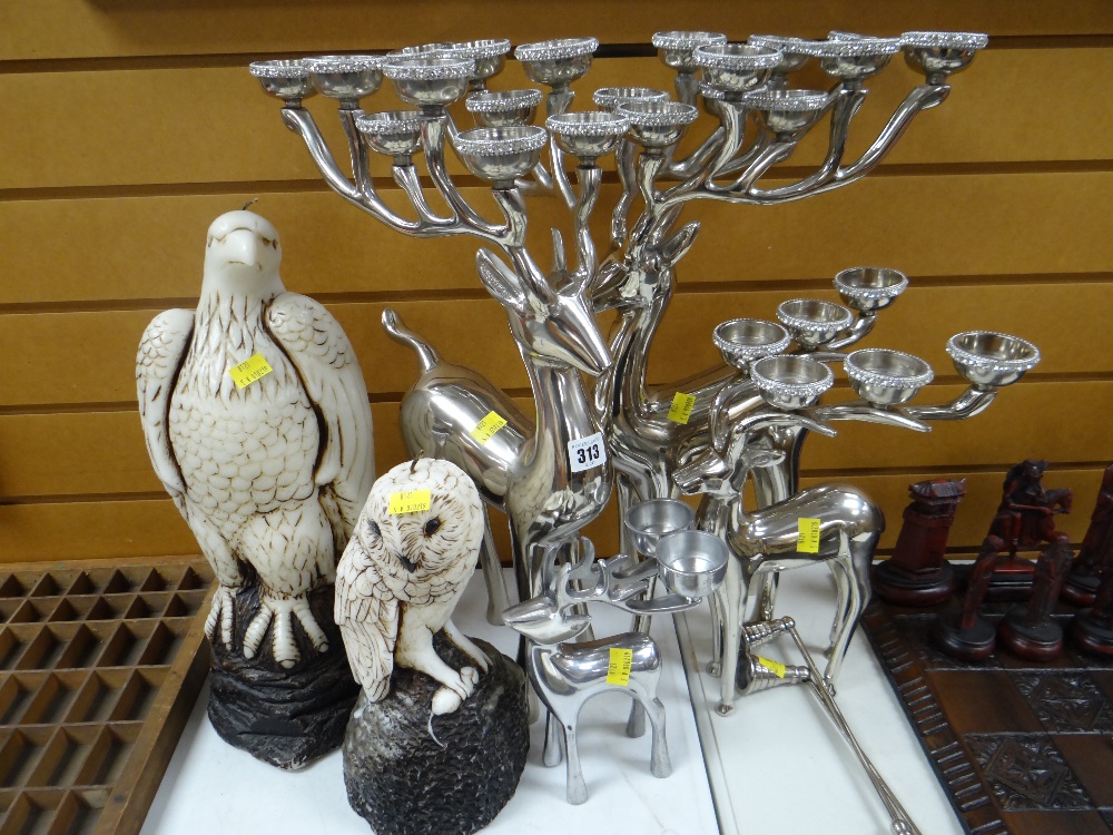 A trio of modern white metal candelabra in the form of deer, another similar smaller & two
