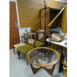 A G-Plan circular-top glass insert coffee table, four chairs for restoration & a carved bamboo