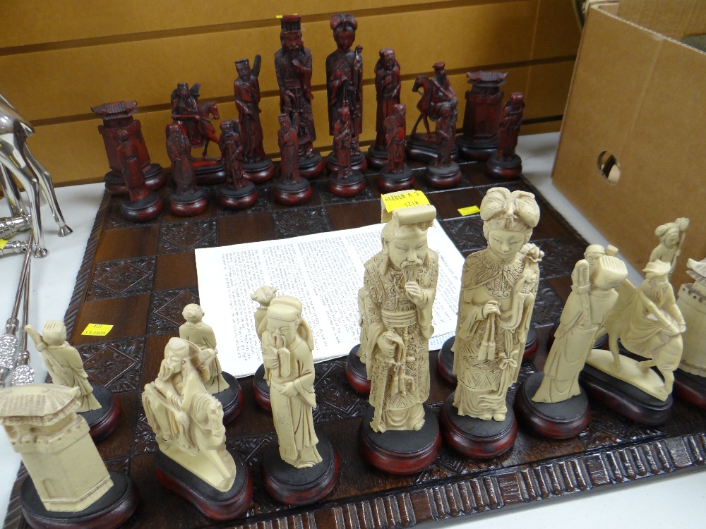 A modern Immortals Oriental-style chess set & a carved chess board Condition reports provided on