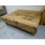 A reclaimed pine Long John coffee-table on casters Condition reports provided on request by email