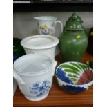 Victorian wash jug, two pottery planters, a pair of green lidded jars and covers and a floral