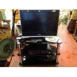 Panasonic LCD TV, a chrome and smoked glass stand and a Panasonic DMR-EZ 47v CD/video player E/T