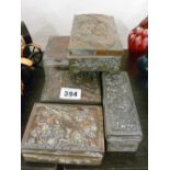 Five Oriental metal lidded trinket boxes with various patterns in relief