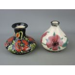 Cobridge stoneware pottery - two squat vases with floral decoration