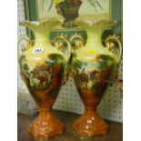 Pair of printed and painted twin handled pottery vases