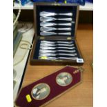 Cased quantity of pastry knives and a gilt metal framed pair of portrait miniatures