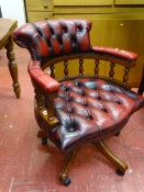 Antique style button upholstered leather effect captain's office armchair on a swivel base