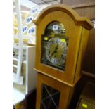 Mid Century reproduction grandmother clock with chiming movement and 1976 presentation plaque