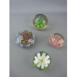 Two millefiori and two floral patterned glass paperweights