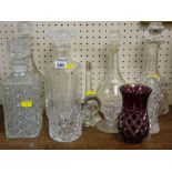 Collection of decanters with stoppers and other glassware