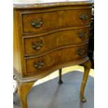 Reproduction walnut serpentine three drawer chest on cabriole supports