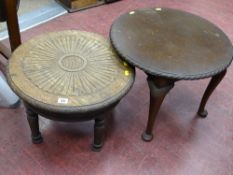 Low circular side table with carved decoration and one other
