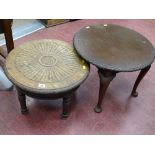 Low circular side table with carved decoration and one other