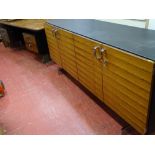 Excellent quality, possibly Scandinavian designer desk having a wood veneer top with faux leather