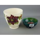 Moorcroft 'Anemone' pottery bowl, 11 cms diameter and a Moorcroft 'Clematis' vase, 13 cms high