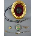 Victorian type black cameo mounted in a gilt frame, a Victoria pendant in a yellow metal mount, a