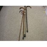 Three vintage walking sticks and one other