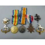 World War I group of three awarded to 40333 Pte D O Lloyd, RAMC, with four military cap badges