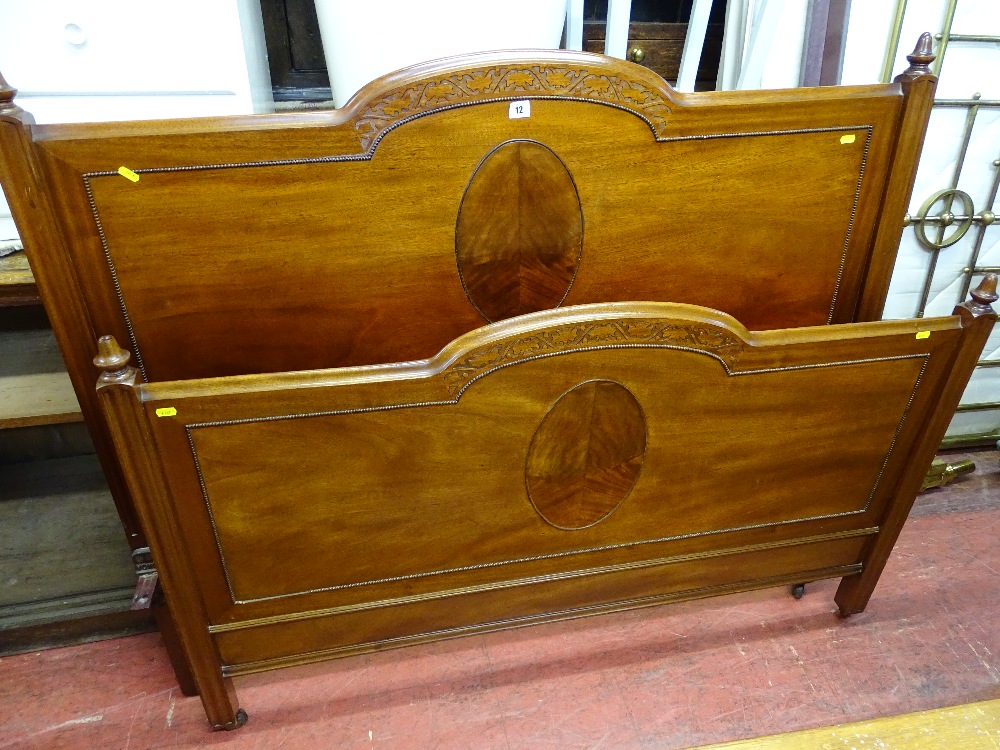 Pair of vintage mahogany bed ends with irons