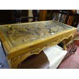 Oriental deep carved glass topped coffee table