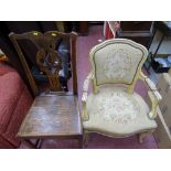 French style painted armchair with tapestry style upholstery and an oak antique farmhouse chair with