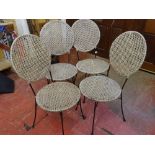 Set of four metal and woven work garden chairs