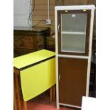 Vintage kitchen cabinet and a yellow twin flap formica top gate leg table