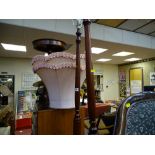 Pair of reproduction mahogany standard lamps with shades