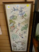 Framed silk and needlework panel depicting various Japanese scenes
