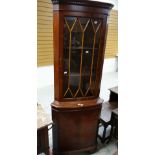 A reproduction mahogany effect standing corner cabinet with glazed top Condition reports provided on