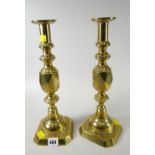 A pair of Ace of Diamonds brass candlestick holders Condition reports provided on request by email