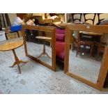 Two modern pine framed mirrors and a pine tripod table Condition reports provided on request by