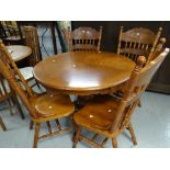 Modern circular breakfast table together with four matching spindle back chairs, 106cms diam. (5)