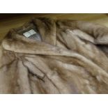 A ladies short mink fur jacket, retailed by Faulkes, Edgbaston, Birmingham together with original
