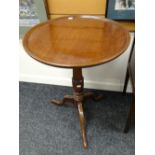 An antique circular oak topped wine / side table on tripod base Condition reports provided on