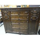 Oak Jacobean-style geometrically moulded chest of drawers cupboard having an arrangement of two