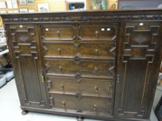 Oak Jacobean-style geometrically moulded chest of drawers cupboard having an arrangement of two