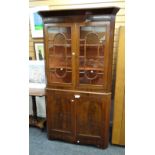 Antique mahogany astragal glazed top standing corner cupboard with two-door cupboard base