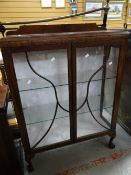 A vintage two-door china cabinet Condition reports provided on request by email for this auction