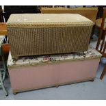 A Lloyd Loom gold coloured ottoman with cushion top and another in pink Condition reports provided